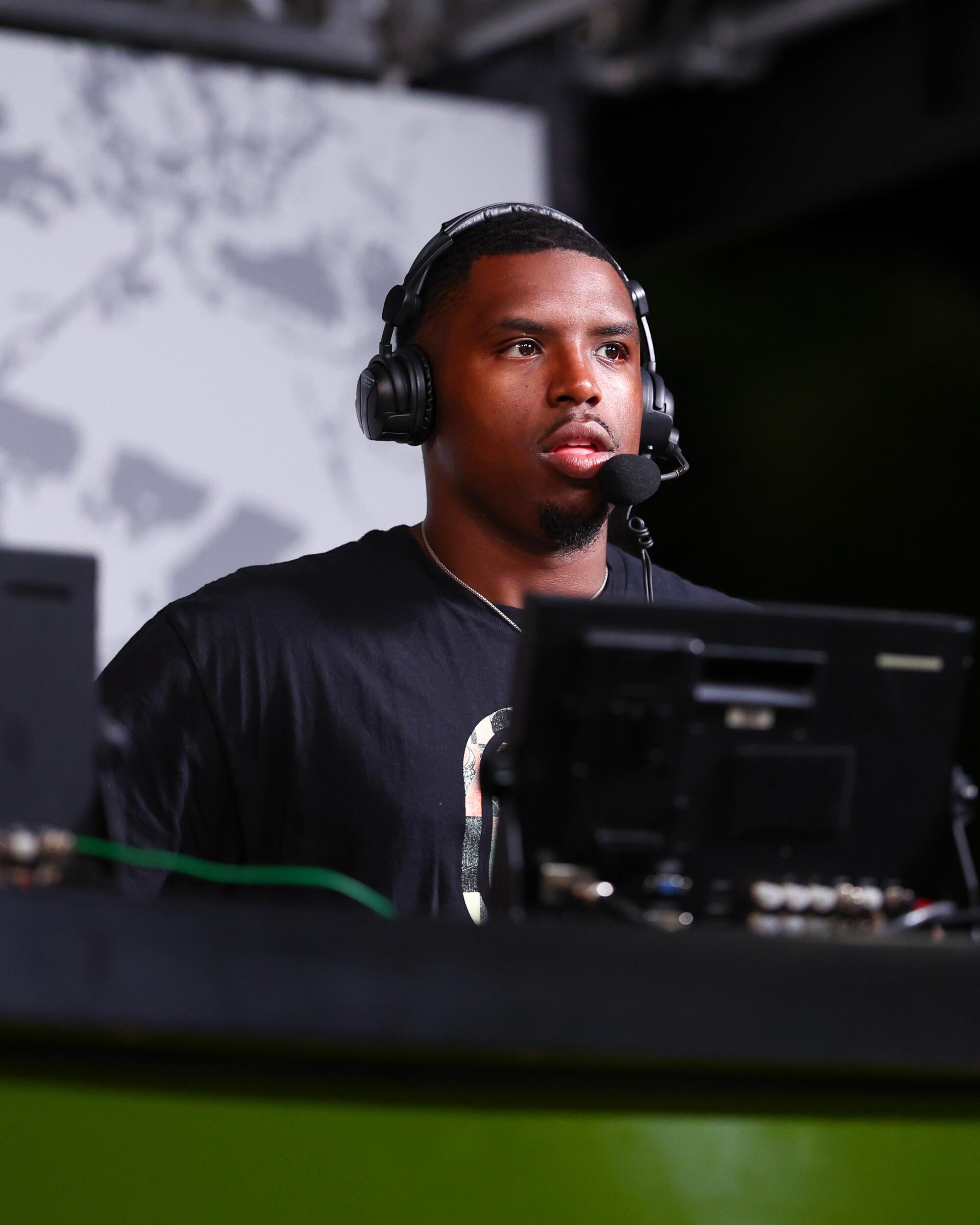 Football commentator broadcasting from stadium